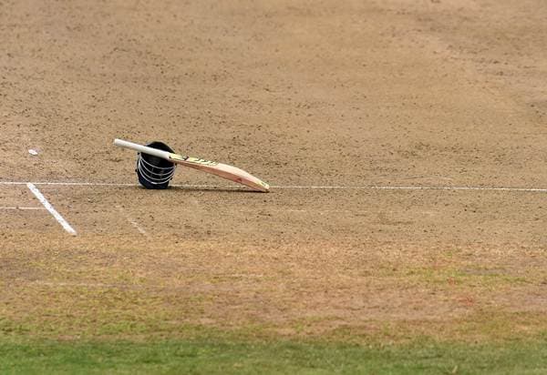 The bat and helmet of Indian cricketer Lokesh Rahul is seen kept on the field as he takes a break during the two-day tour match between India and WICB President's XI squad at the Warner Park stadium in Basseterre, Saint Kitts, on July 9, 2016.  / AFP / Jewel SAMAD        (Photo credit should read JEWEL SAMAD/AFP/Getty Images)