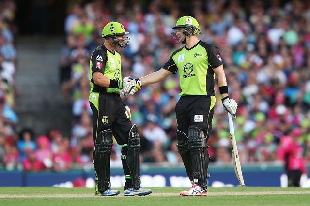SYDNEY, AUSTRALIA - JANUARY 16: Shane Watson of the Thunder celebrates scoring his half century with team mate Mike Hussey during the Big Bash League match between the Sydney Sixers and the Sydney Thunder at Sydney Cricket Ground on January 16, 2016 in Sydney, Australia.  (Photo by Brendon Thorne - CA/Cricket Australia/Getty Images)