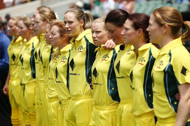 Australia women players line up for the anthem
