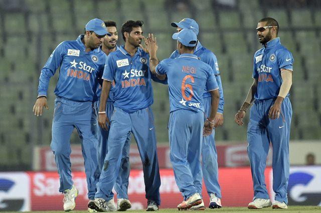 Bhuvneshwar Kumar celebrates with teammates