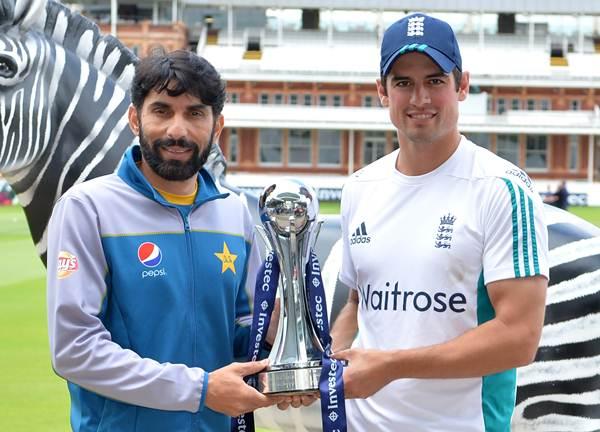 England's captain Alastair Cook (R) and Pakistan's captain Misbah-ul-Haq pose for a photograph with the Investec trophy at Lord's cricket ground. (Photo by OLLY GREENWOOD/AFP/Getty Images)