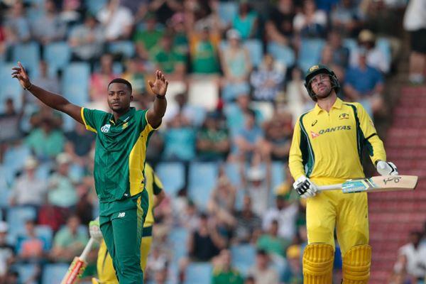 South African bowler Andile Phehlukwayo (L) celebrates the dismissal of Australian batsman John Hastings (R) during the One Day International (ODI) cricket match between South Africa and Australia at the Centurion cricket ground in Centurion, South Africa on September 30, 2016. / AFP / GIANLUIGI GUERCIA (Photo credit should read GIANLUIGI GUERCIA/AFP/Getty Images)