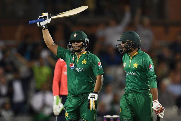 Pakistan's Khalid Latif (L) celebrates his half-century during the T20 international cricket match between England and Pakistan at The Emirates Old Trafford, in Manchester, north-west England, on September 7, 2016. / AFP / PAUL ELLIS / RESTRICTED TO EDITORIAL USE. NO ASSOCIATION WITH DIRECT COMPETITOR OF SPONSOR, PARTNER, OR SUPPLIER OF THE ECB (Photo credit should read PAUL ELLIS/AFP/Getty Images)