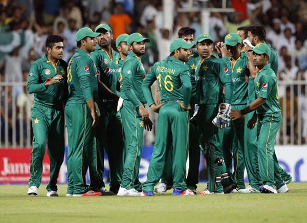 Pakistan's players celebrate after bowling out West Indies' batsman Johnson Charles (L) during the 1st ODI match between Pakistan and West Indies at the Sharjah Cricket Stadium, on September 30, 2016. / AFP / KARIM SAHIB (Photo credit should read KARIM SAHIB/AFP/Getty Images)