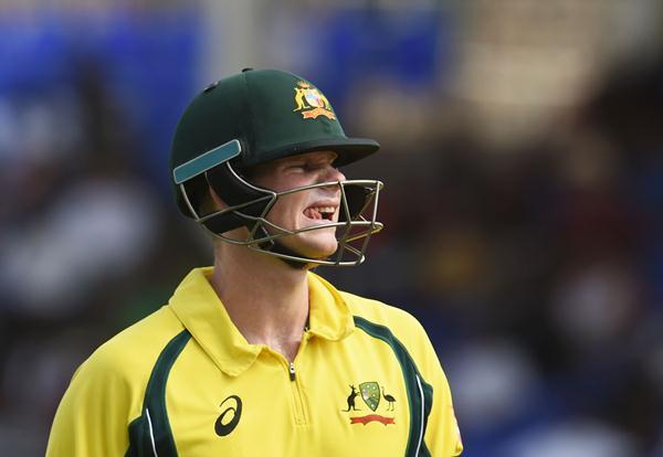 Australian cricket team captain Steven Smith leaves the field after being dismissed by West Indies bowler Carlos Brathwaite during their One Day International match of the Tri-nation Series at the Warner Park stadium in Basseterre, Saint Kitts, on June 13, 2016. / AFP / Jewel SAMAD        (Photo credit should read JEWEL SAMAD/AFP/Getty Images)