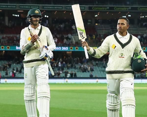 Usman Khawaja of Australia is applauded off the field at the end of play during day two. (Photo by Cameron Spencer/Getty Images)