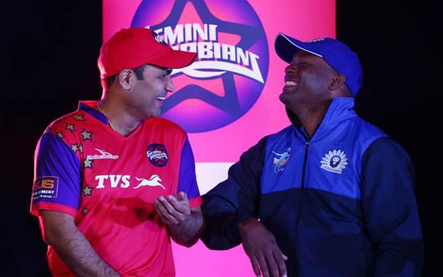 Virender Sehwag shares a joke with Brian Lara