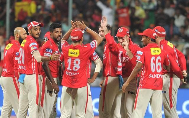 Kings XI Punjab players celebrate fall of a wicket