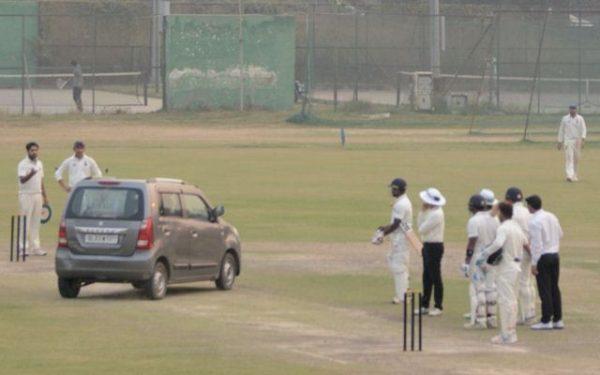 A car enters on to the pitch during Delhi vs UP Ranji game in Pallam