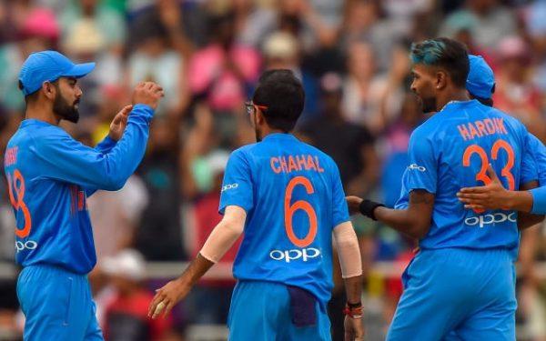 India's captain Virat Kohli congratulates teammate Hardik Pandya