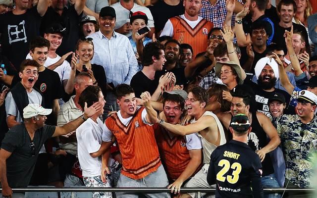 A fan catches a six one-handed to win $50,000 as part of the Tui catch competition during the International Twenty20 match between New Zealand and Australia at Eden Park.