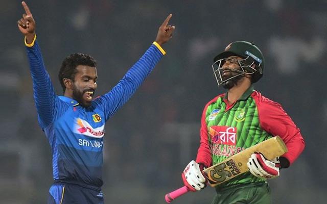 Sri Lanka cricketer Amila Aponso celebrates after the dismissal of the Bangladesh cricketer Tamim Iqbal