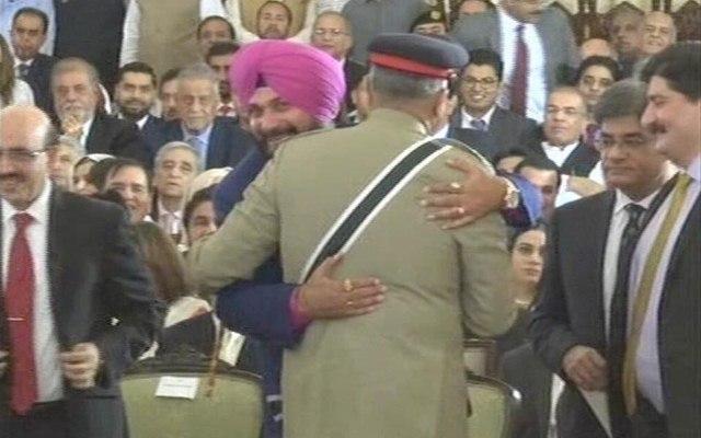 Former Indian cricketer Navjot Singh Sidhu hugts Pakistan Army Chief General Qamar Javed Bajwa at Imran Khan's oath-taking ceremony in Islamabad