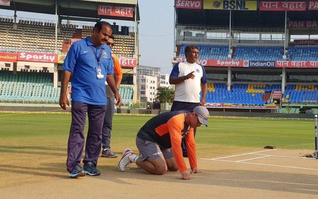 MS Dhoni inspecting the pitch
