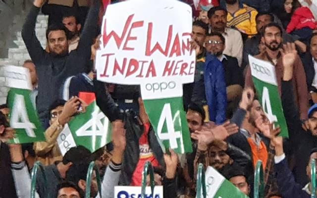 Amongst many fans, there was one who was holding a placard wanting India to visit the country.