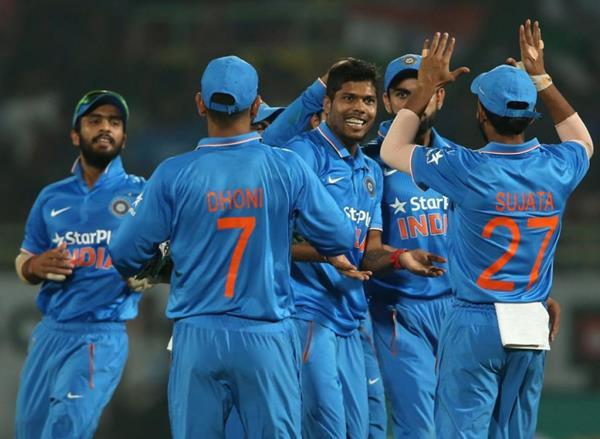 Indian players celebrate a wicket