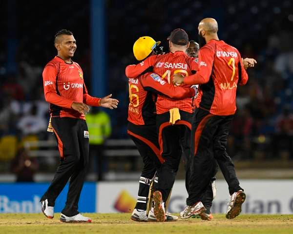 Port of Spain , Trinidad And Tobago - 29 June 2016; Sunil Narine, left, of Trinbago Knight Riders celebrates with teammates the dismissal of Johnson Charles of St Lucia Zouks during Match 1 of the Hero Caribbean Premier League between Trinbago Knight Riders and St Lucia Zouks at the Queen's Park Oval in Port of Spain, Trinidad. (Photo By Randy Brooks/Sportsfile via Getty Images)