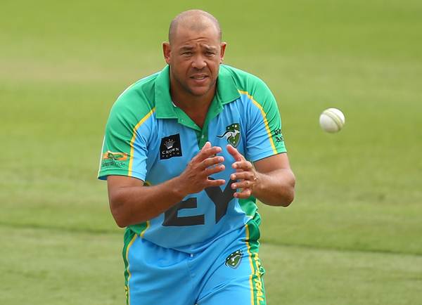 PERTH, AUSTRALIA - DECEMBER 15: Andrew Symonds of the Legends XI fields a return throw during the Twenty20 match between the Perth Scorchers and Australian Legends at Aquinas College on December 15, 2014 in Perth, Australia. (Photo by Paul Kane - CA/Cricket Australia/Getty Images)